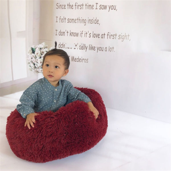 Overhead view of the grey FurryFable calming pet bed, showcasing its soft texture