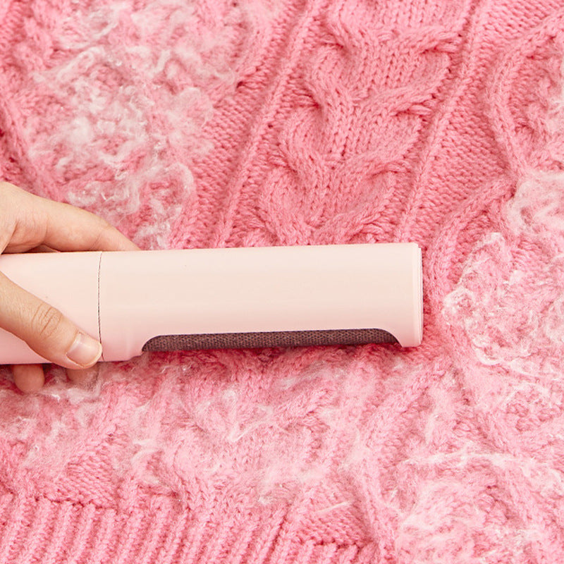 FurryFable pet hair remover brush effectively cleaning a fabric cushion