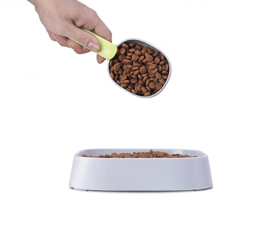 Detailed view of the FurryFable pet food spoon's durable ABS material and ergonomic design