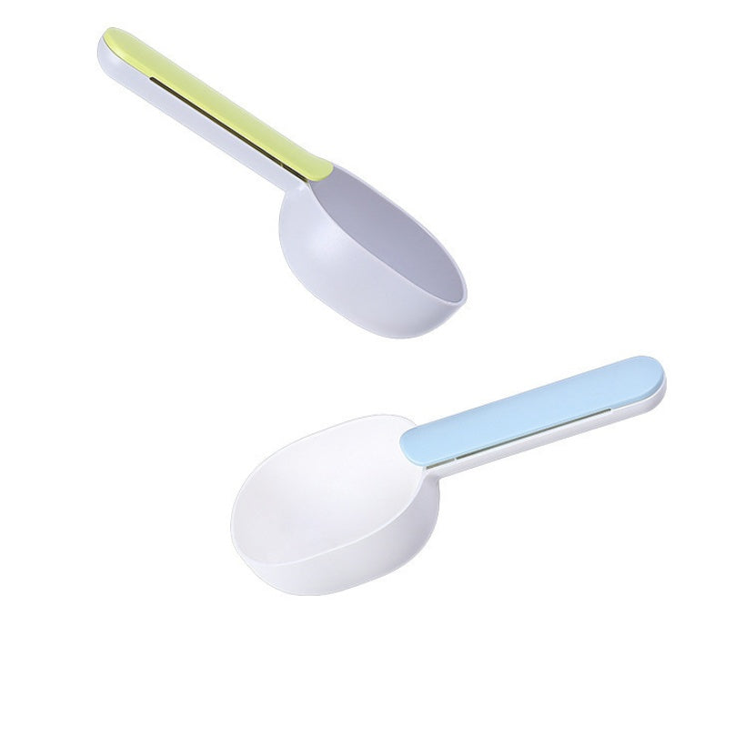 Pet food spoon in powder coffee color, resting next to a bag of dog food