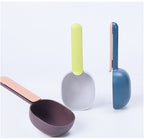 FurryFable pet food scoop in pink and blue, demonstrating its size and depth