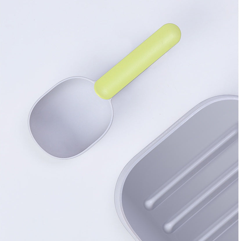 White and gray FurryFable pet food spoon, highlighting its smooth, easy-to-clean surface